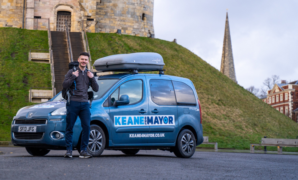 Keane Duncan with his campaign campervan