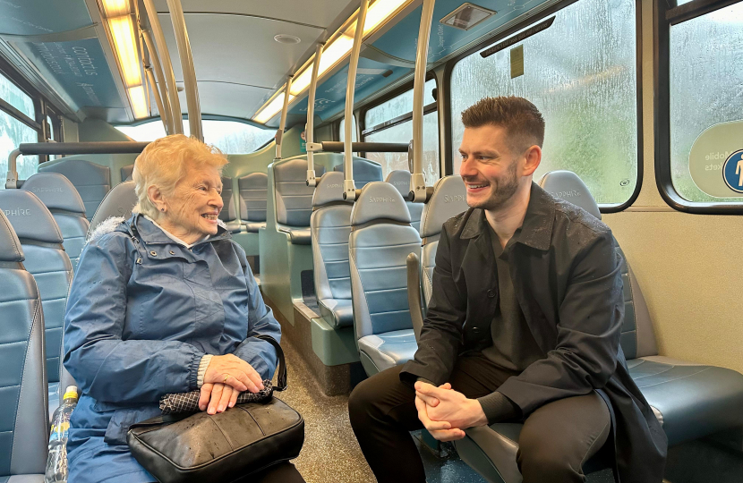 Keane speaking to a bus user